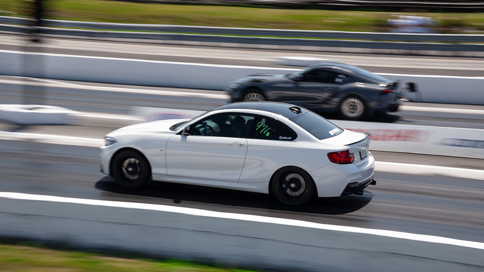 A BMW M2 launching down the strip