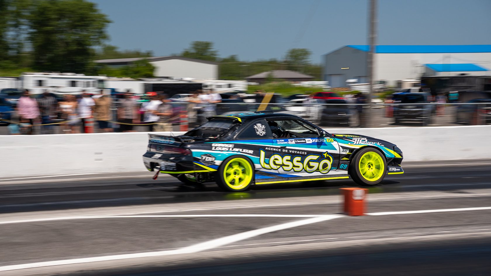 A liveried drift car on track