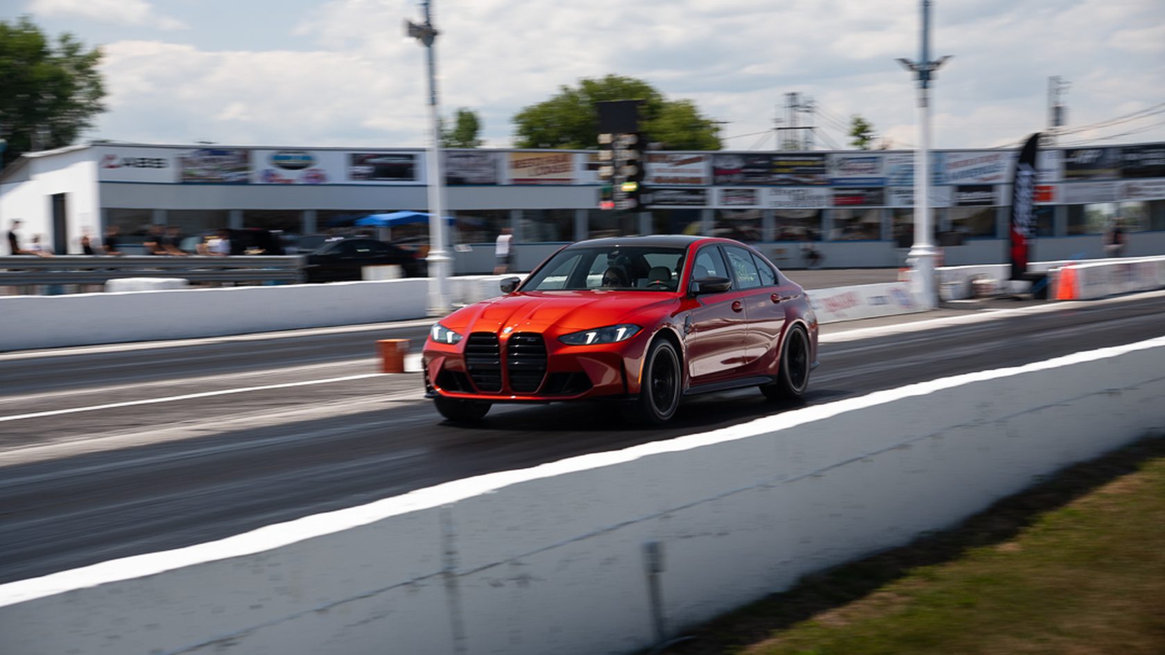 A red BMW M3 on the strip